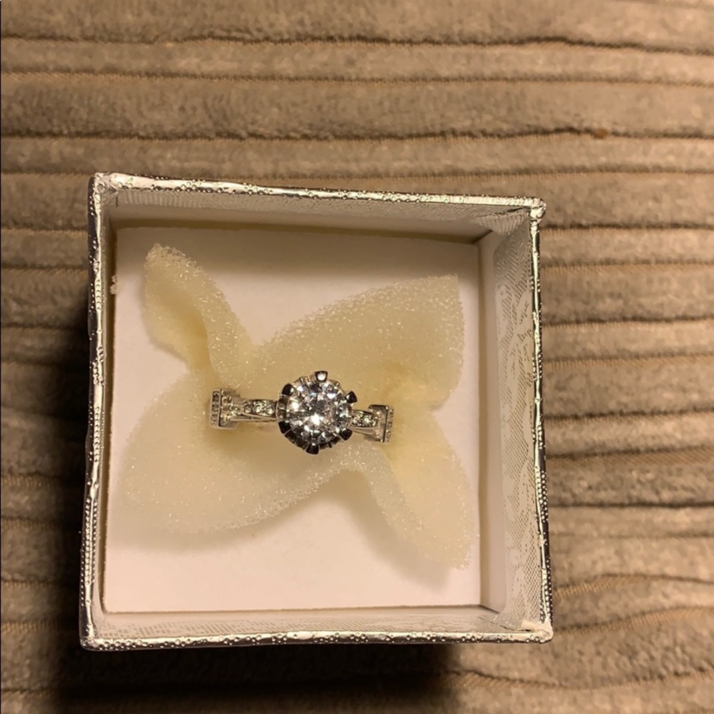 High set solitaire with accents brilliant cut cz